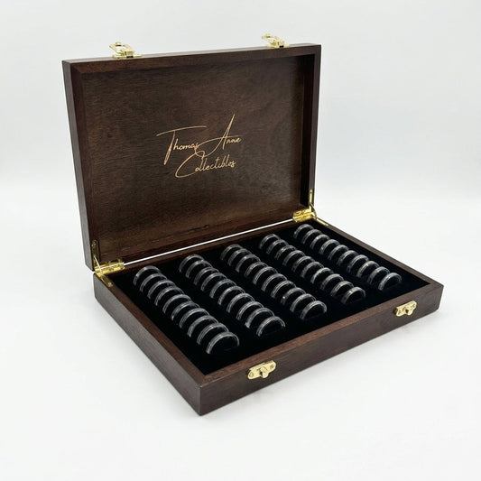 Handcrafted mahogany coin archive case on an angle with deep walnut finish and brass latches, featuring 50 slots for Australian one dollar coins